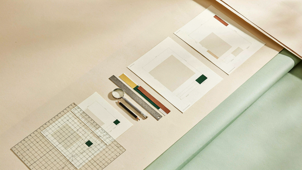 空白 layout cards、透明 grid、尺、放大鏡與色票的編輯工作桌